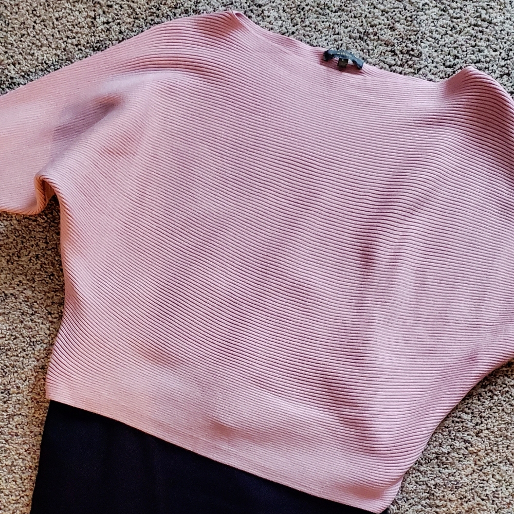 Rose petal pink knit top.